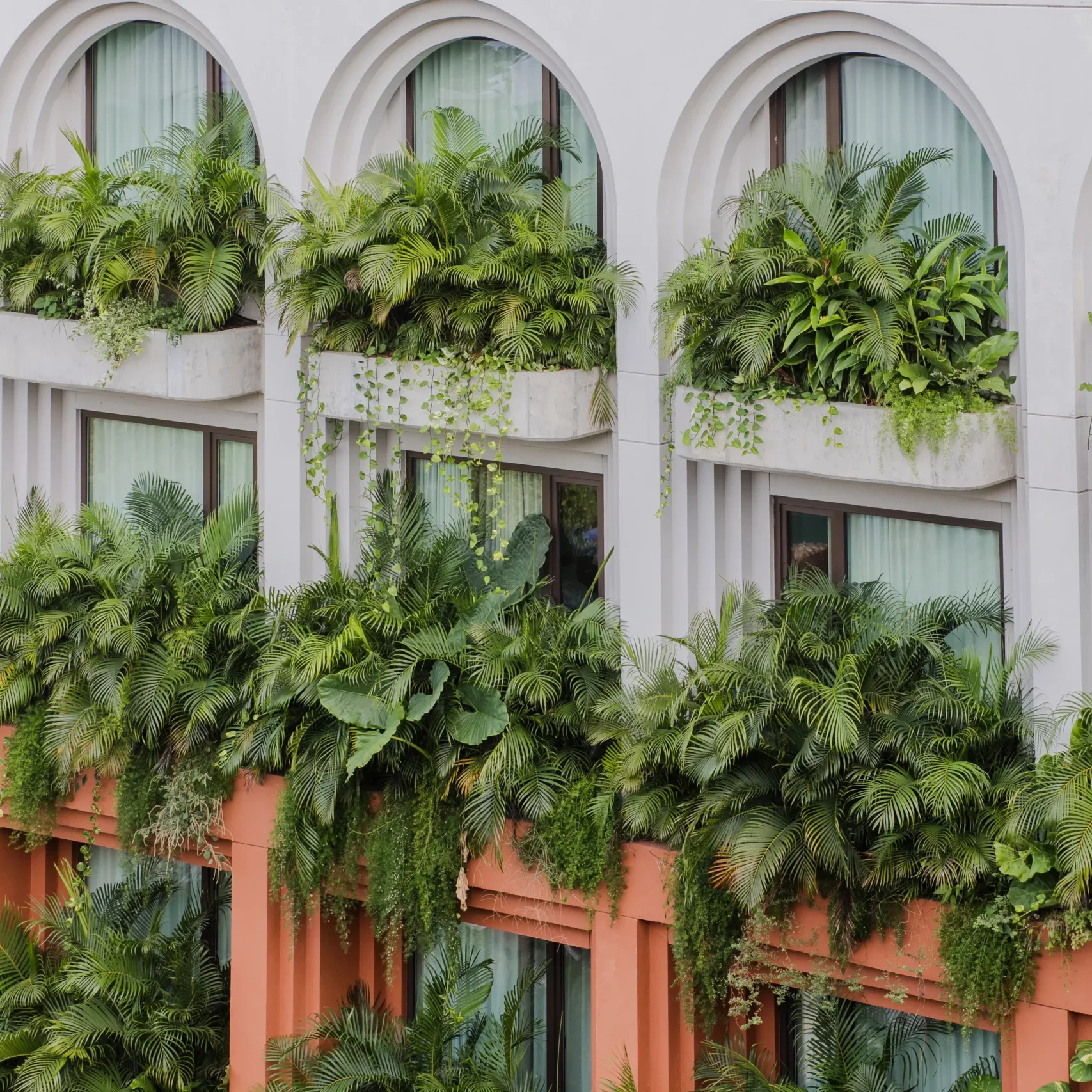 Facade with balconies and tropical gardens at OSH Hotel Cartagena